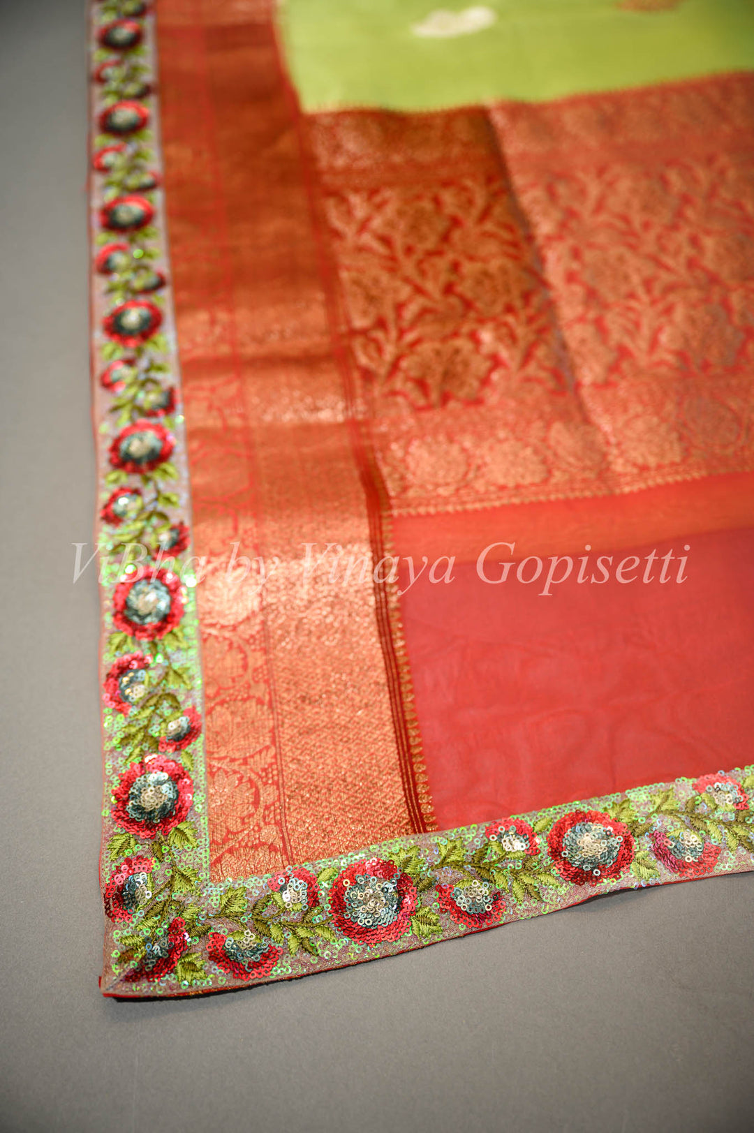 Parrot Green and Red Banarasi Organza Saree Embellished With Embroidered Borders