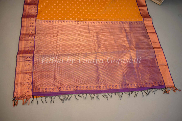 Deep Mustard And Purple Kanchi Silk Saree And Blouse With Copper Zari