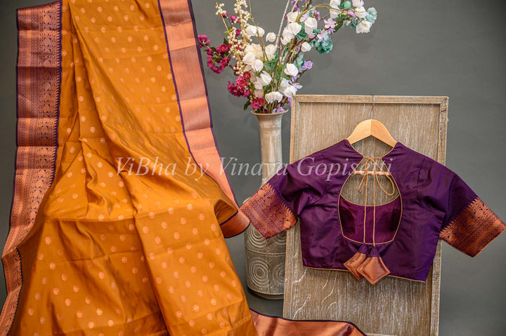 Deep Mustard And Purple Kanchi Silk Saree And Blouse With Copper Zari