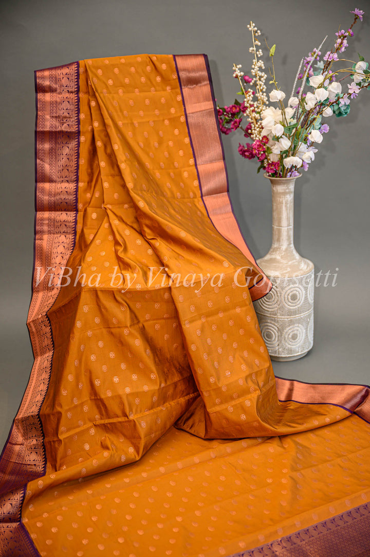 Deep Mustard And Purple Kanchi Silk Saree And Blouse With Copper Zari