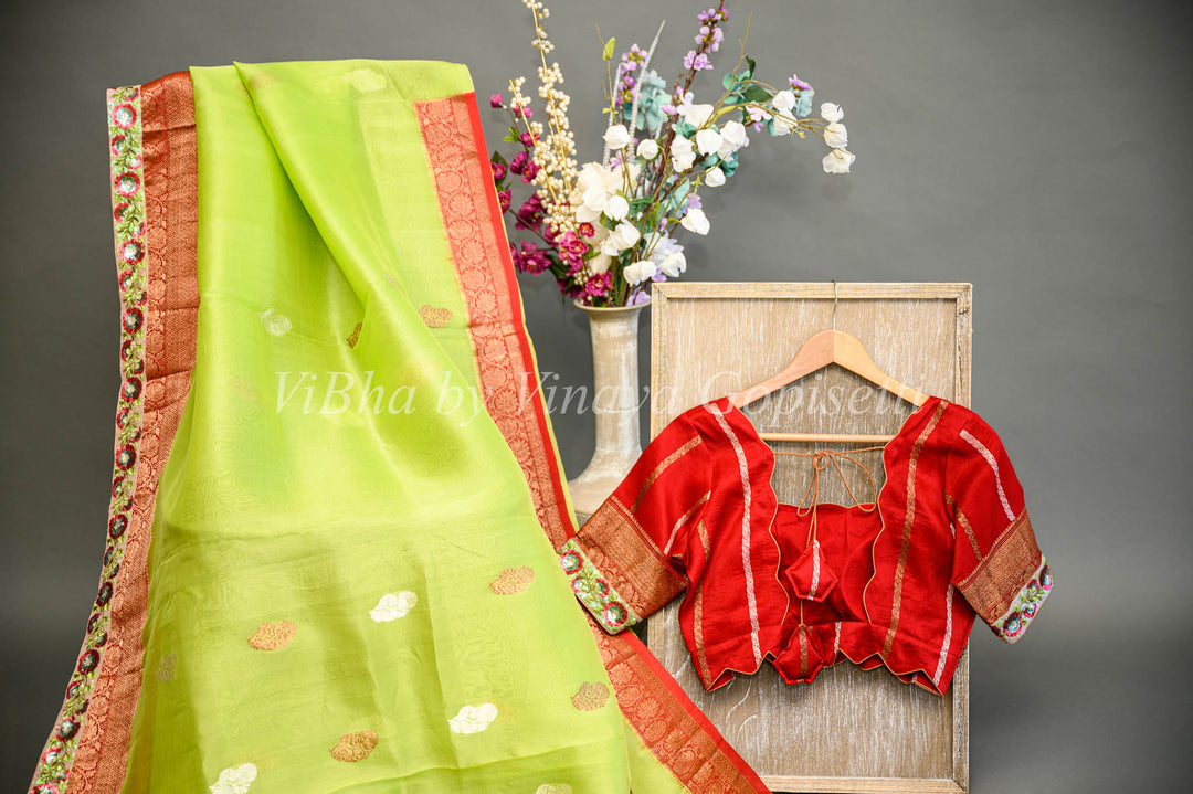 Parrot Green and Red Banarasi Organza Saree Embellished With Embroidered Borders