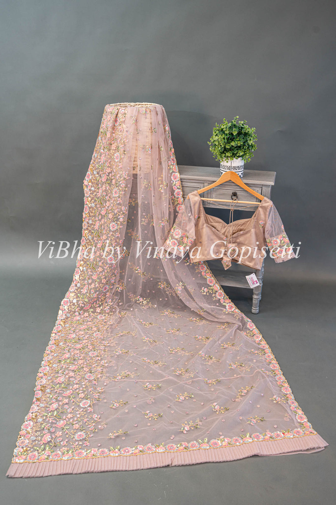 Pastel Mauve Net Floral Embroidered Saree And Blouse