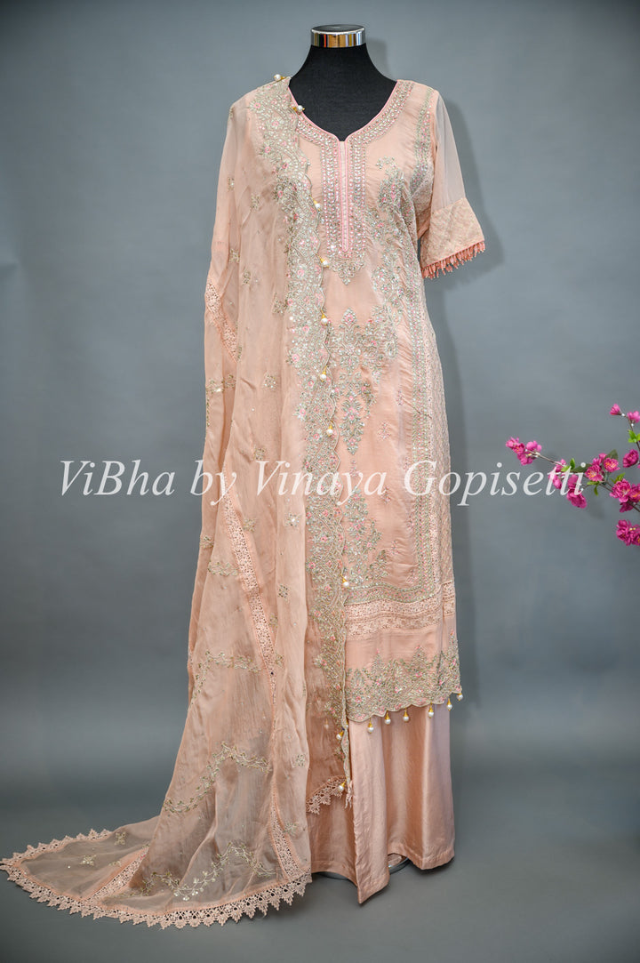 Pastel Peach Palazzo Set Embellished With Elegant Kundan And Zari Embroidery Work