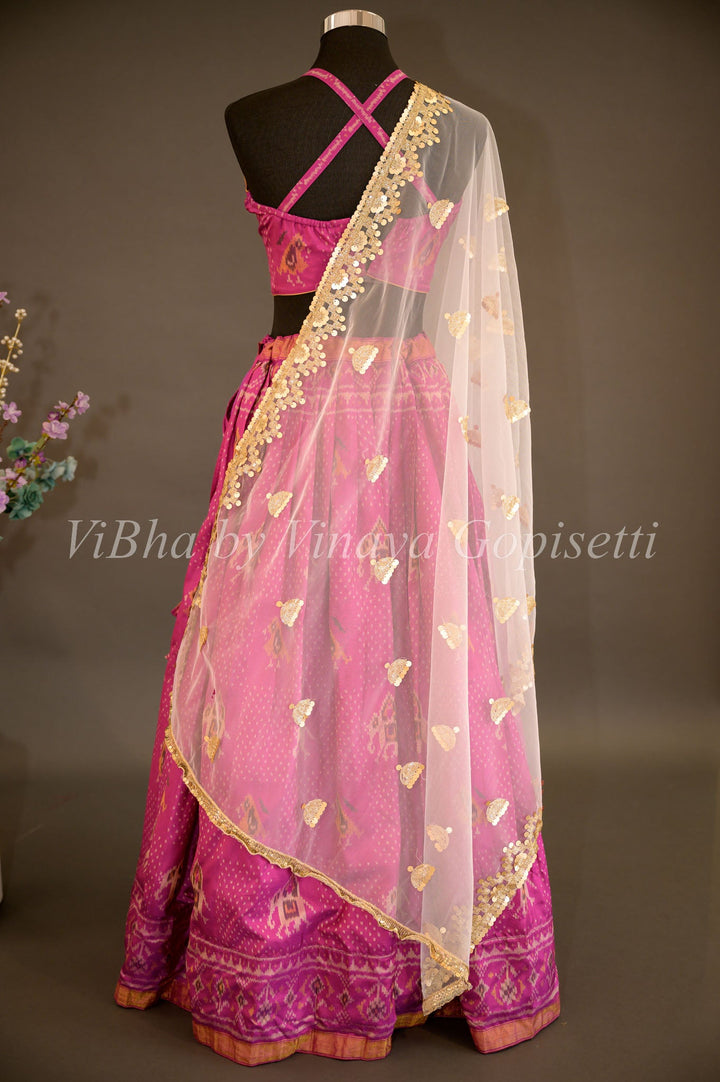 Lehengas - Magenta Patola Silk Lehenga With Cross Back Blouse And Pearl White Embroidered Dupatta