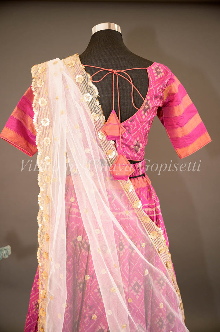 Lehengas - Magenta Patola Silk Lehenga With V Neck Blouse And Pearl White Embroidered Dupatta