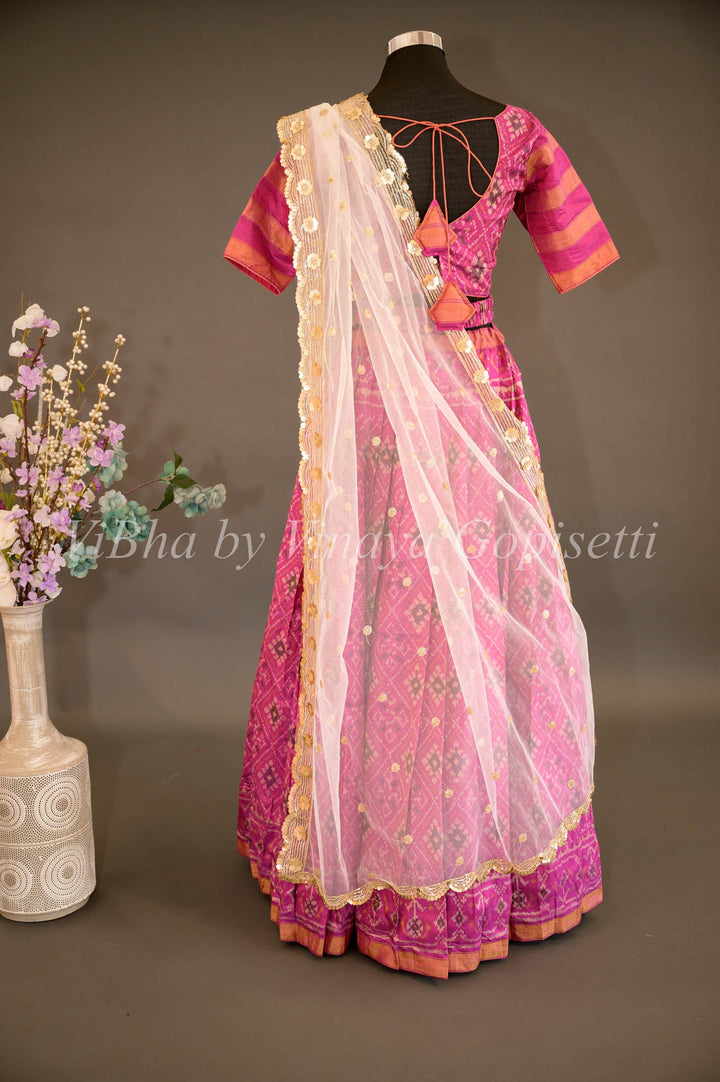 Lehengas - Magenta Patola Silk Lehenga With V Neck Blouse And Pearl White Embroidered Dupatta