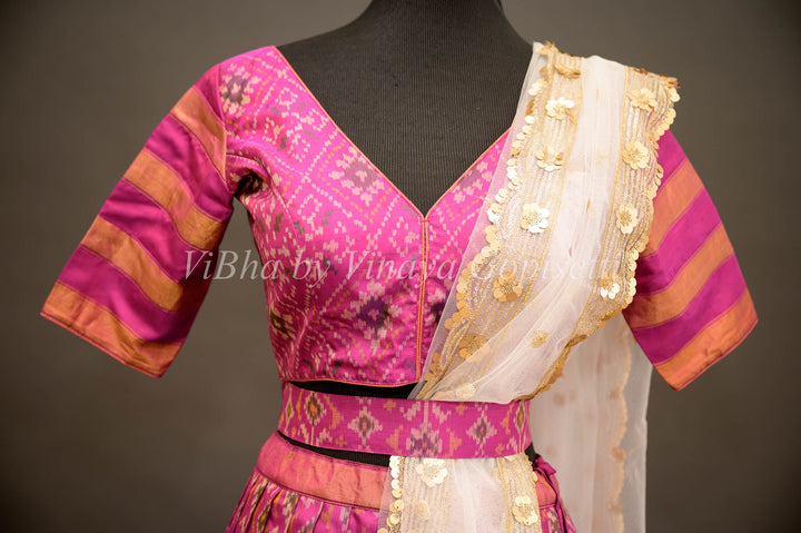 Lehengas - Magenta Patola Silk Lehenga With V Neck Blouse And Pearl White Embroidered Dupatta