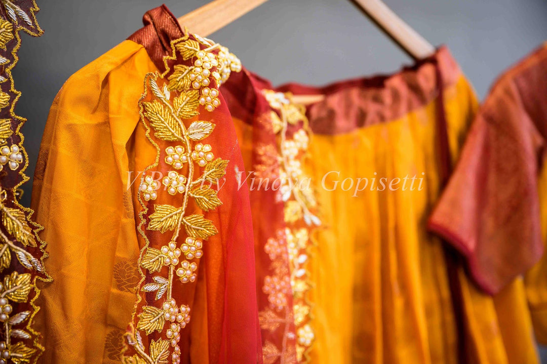 Lehengas - Turmeric Yellow And Maroon Red Kanchi Silk Halfsaree