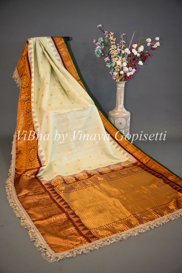 Sarees - Pista Green And Dark Brown Gadwal Silk Saree And Blouse With Embroidered Borders